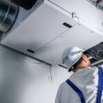 C1 Featured Image HVAC Tech Inspecting A Unit
